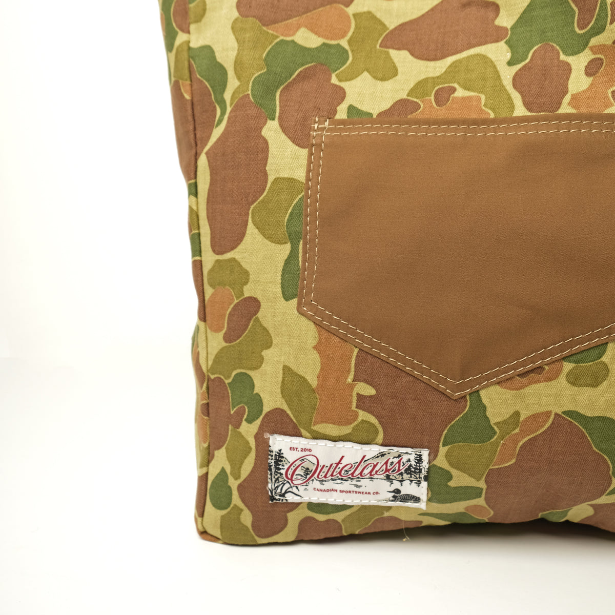 Reversible camo tote bag close-up of front pocket and stitched label patch