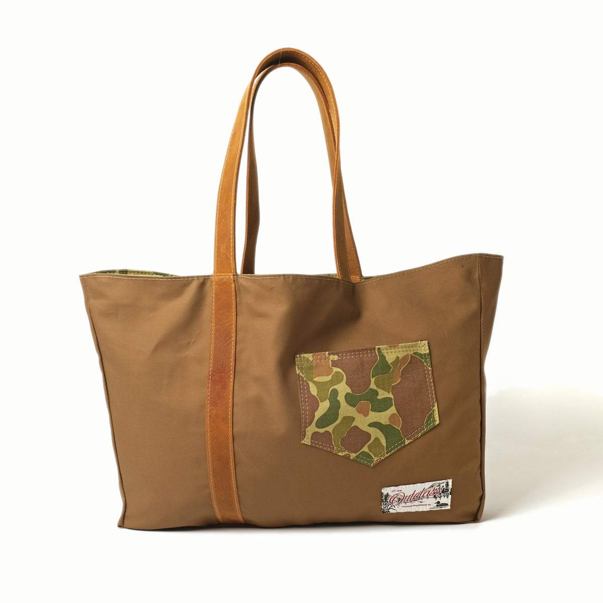 Reversible tote bag in brown with camo patch pocket and brown leather handles