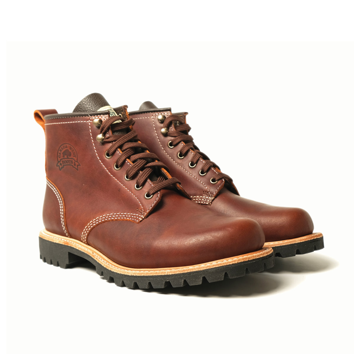 Brown lace-up hiking boots with padded collar and rugged black tread soles.