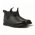 Black Chelsea boot angled view, elastic gore panels and side pull tabs, rubber sole