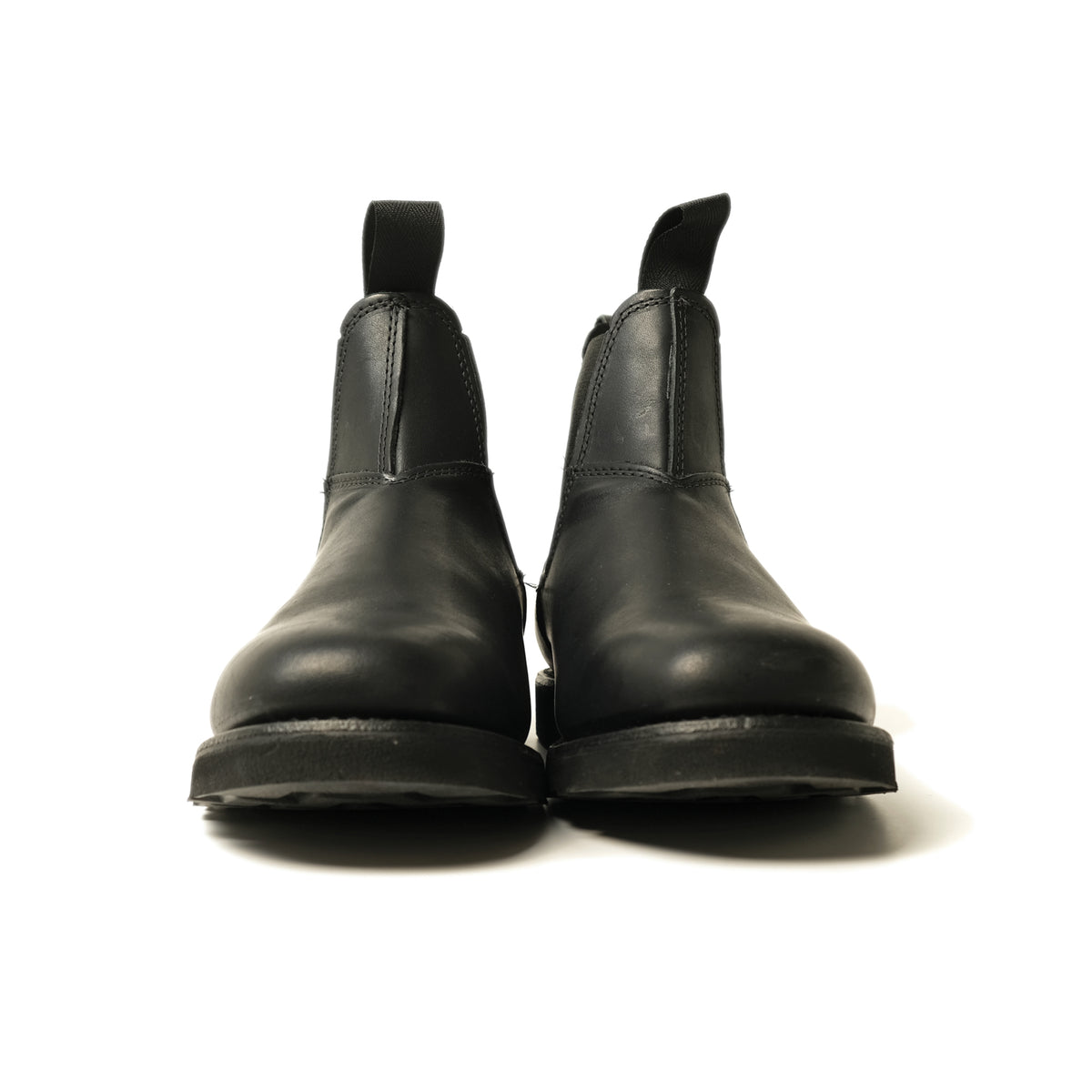 Black Chelsea boot pair from front, ankle height with elastic side panels