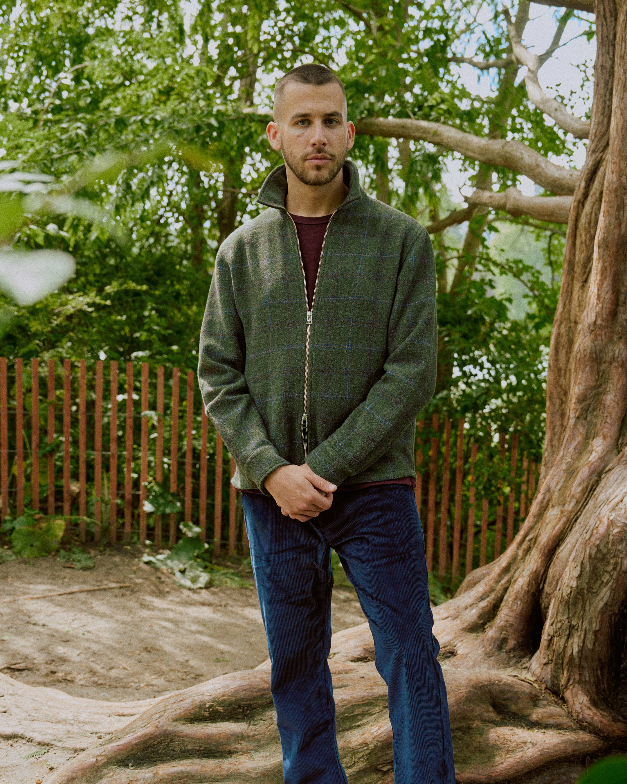 Olive plaid wool zip overshirt with stand collar, long sleeves, front zipper.