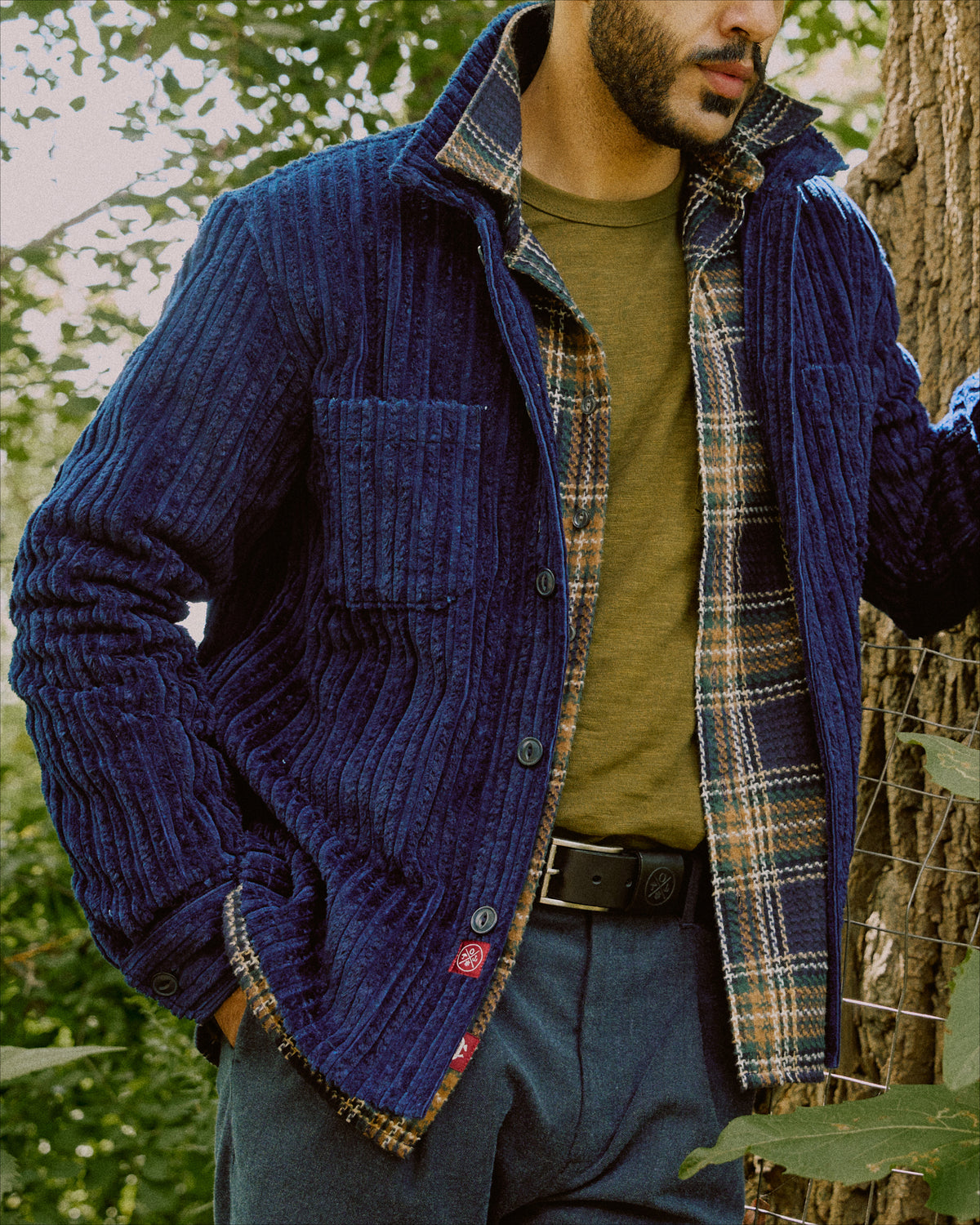 Dark navy corduroy club shirt with button front, flap chest pockets, long sleeves