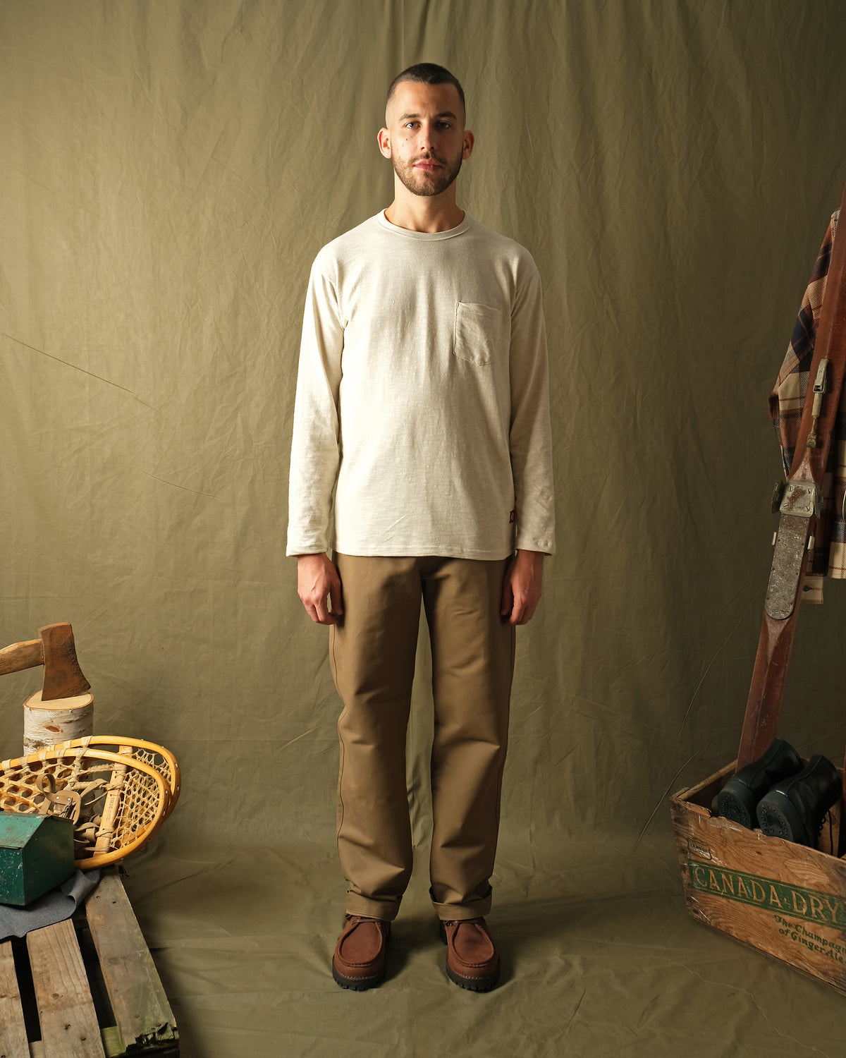 Tan moleskin engineer pants on model, straight-leg silhouette with side pockets
