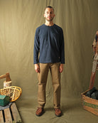 Navy long-sleeve crewneck T-shirt with chest pocket, on-model view