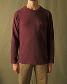 Maroon long-sleeve T-shirt with chest pocket and crew neck, textured slub knit.
