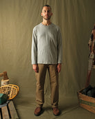 Heather gray long-sleeve t-shirt with chest pocket and crew neck worn by model