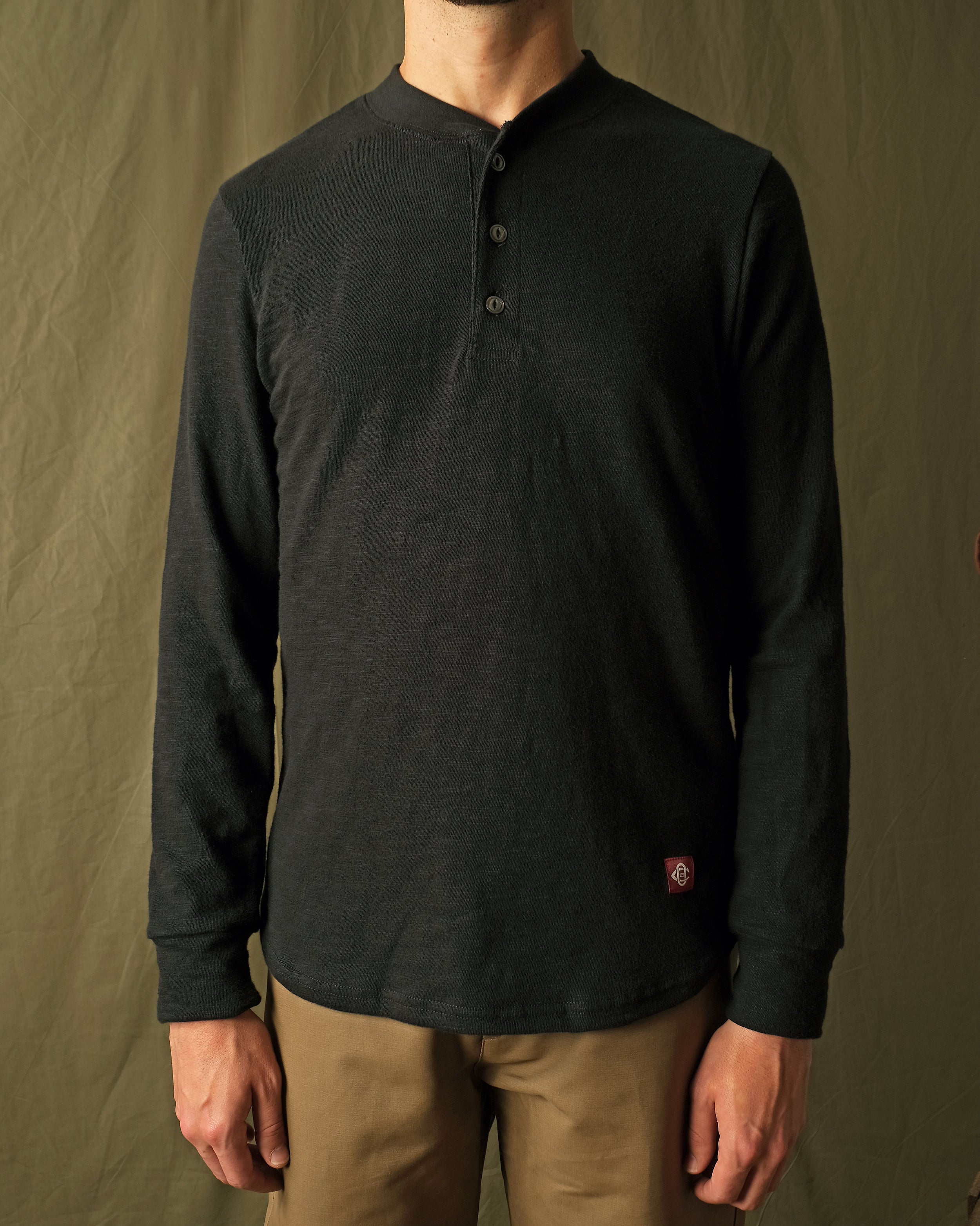 Black slub long-sleeve henley shirt, henley button placket and long sleeves