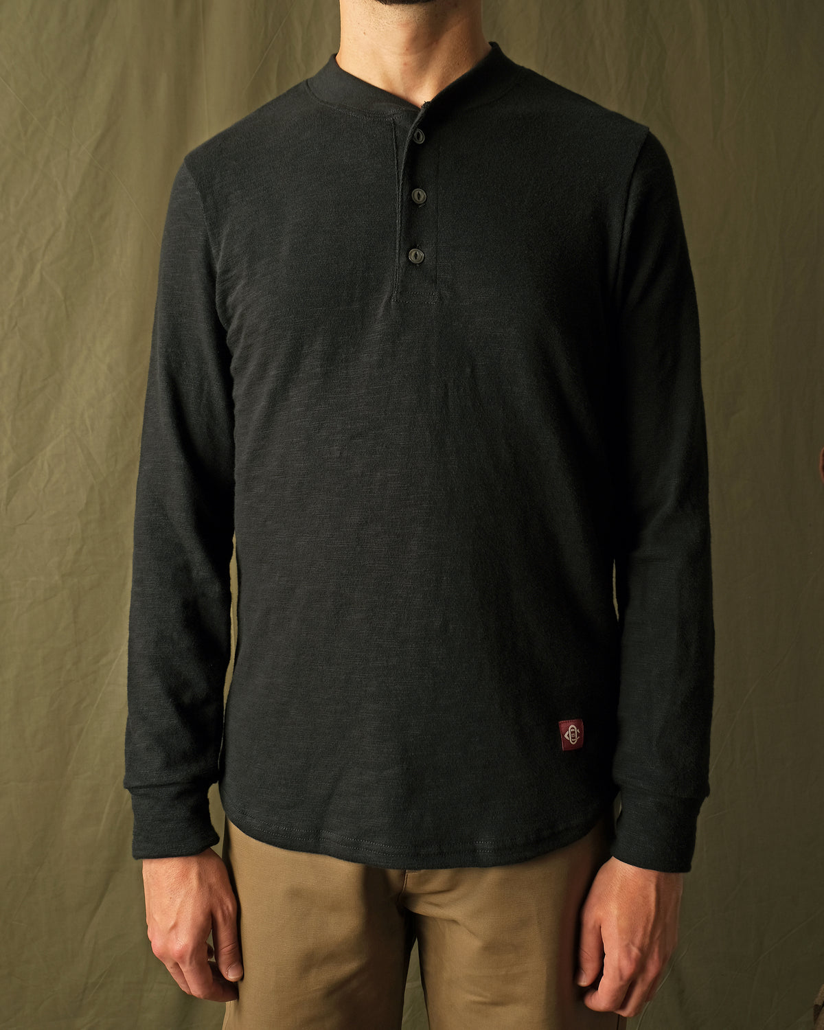 Black slub long-sleeve henley shirt, henley button placket and long sleeves