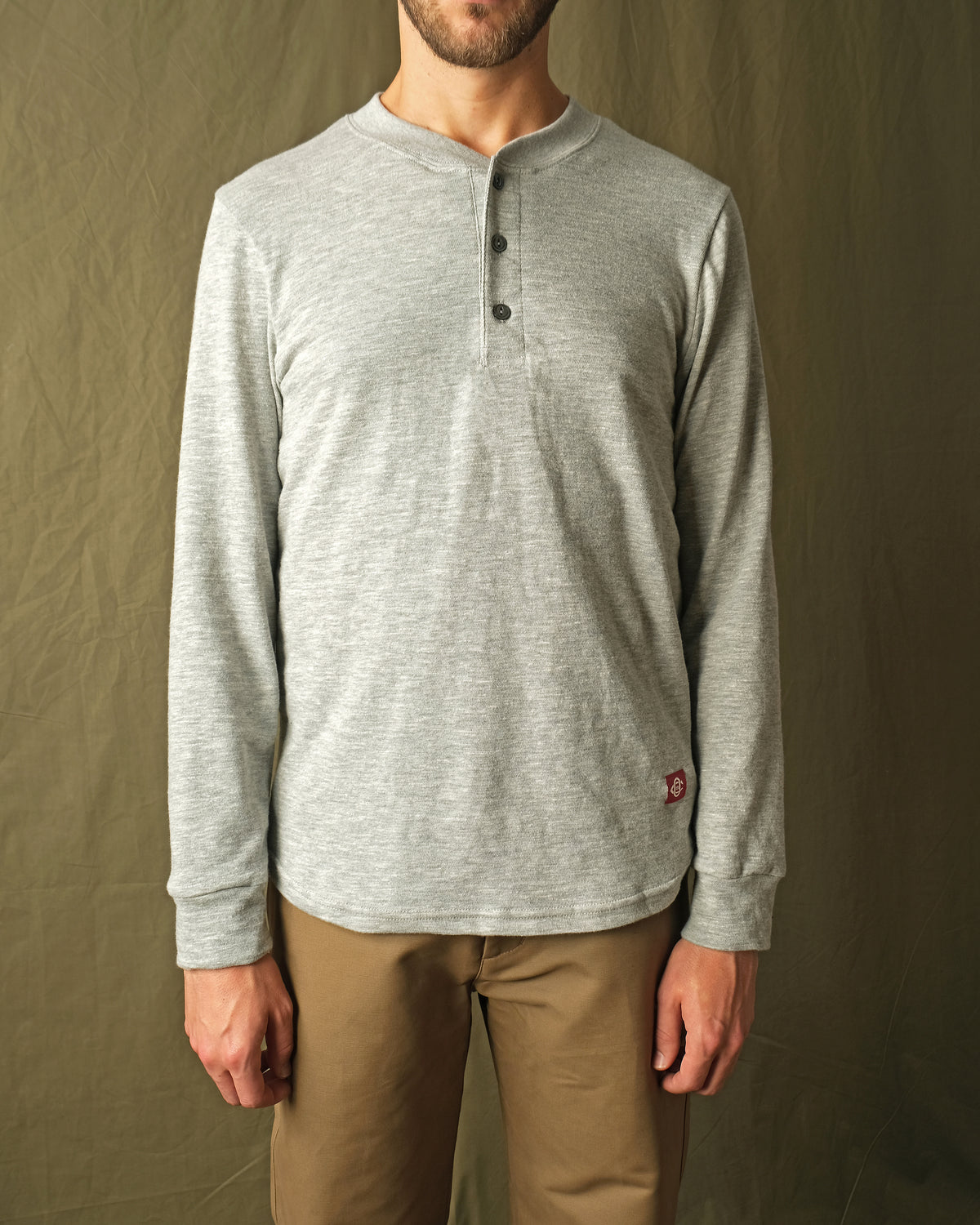 Heather grey slub long-sleeve henley with button placket and straight hem