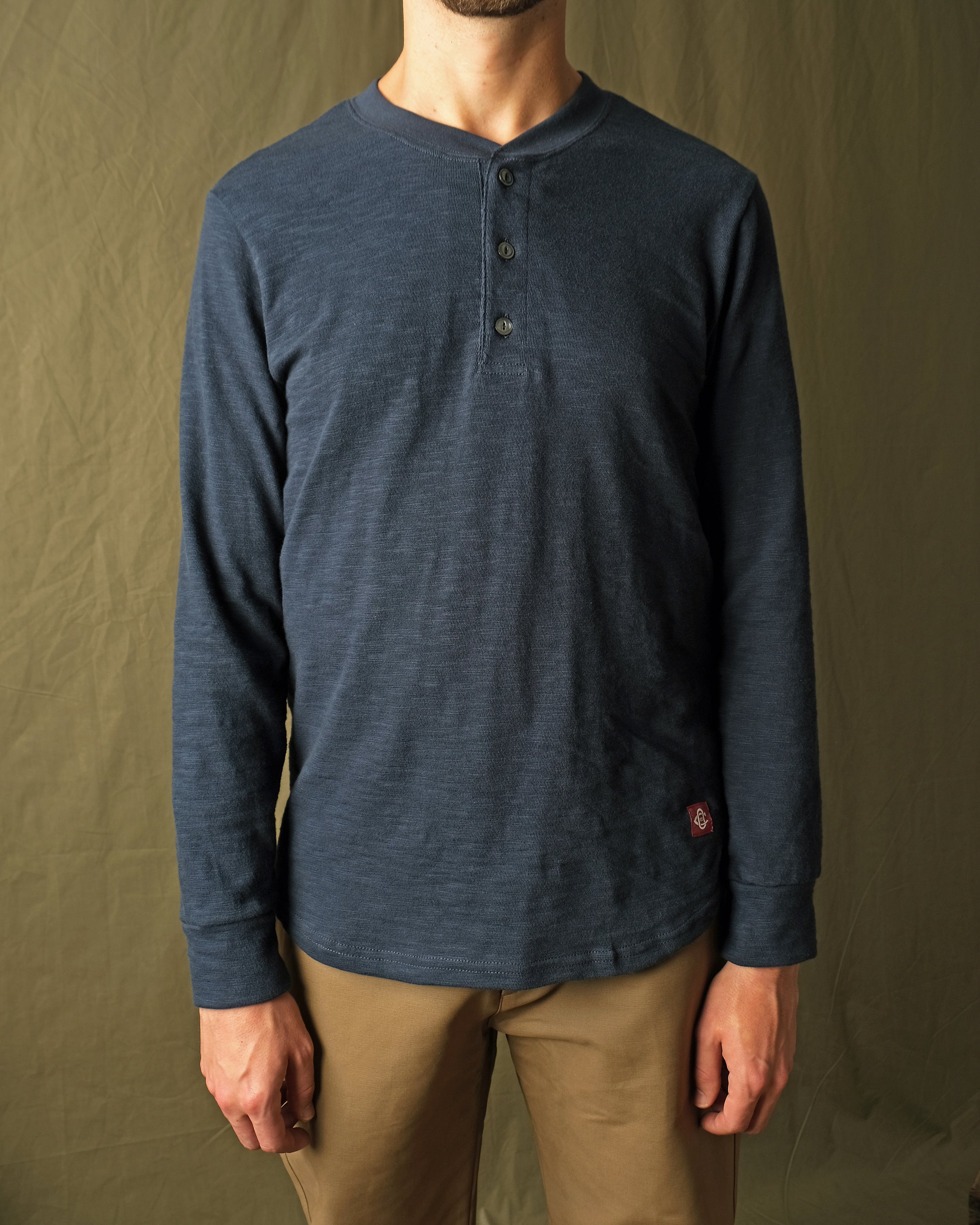 Navy double-slub long-sleeve henley shirt on model with 3-button front