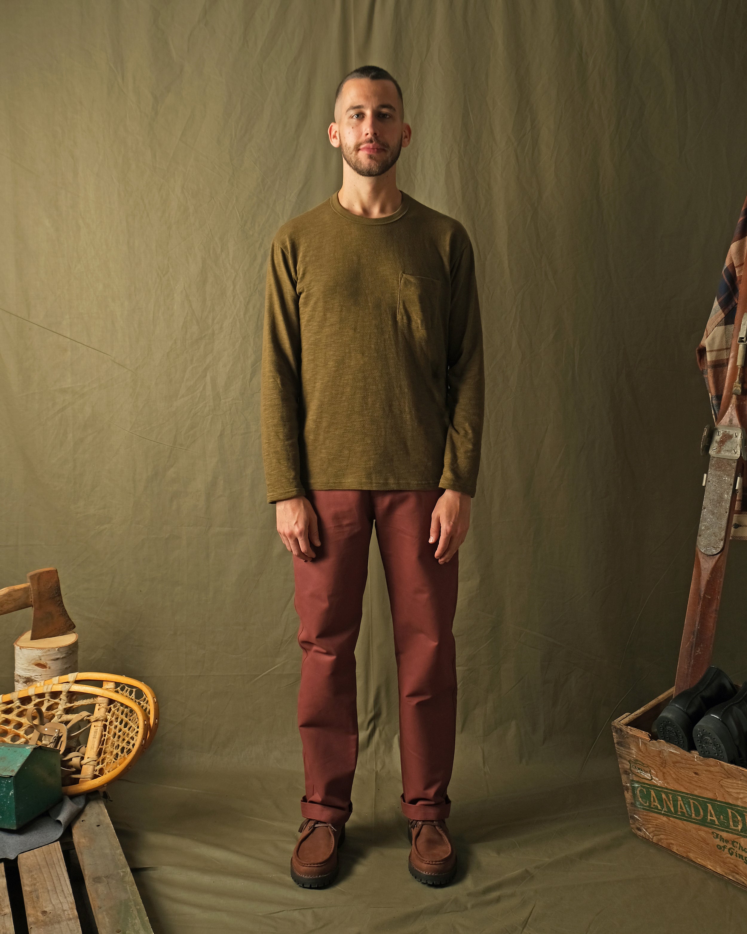 Olive long-sleeve pocket T-shirt on model, crew neck