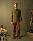 Brick red engineer pants on model, relaxed fit with cuffed hems