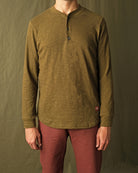 Olive long-sleeve henley shirt on model, button placket at center front