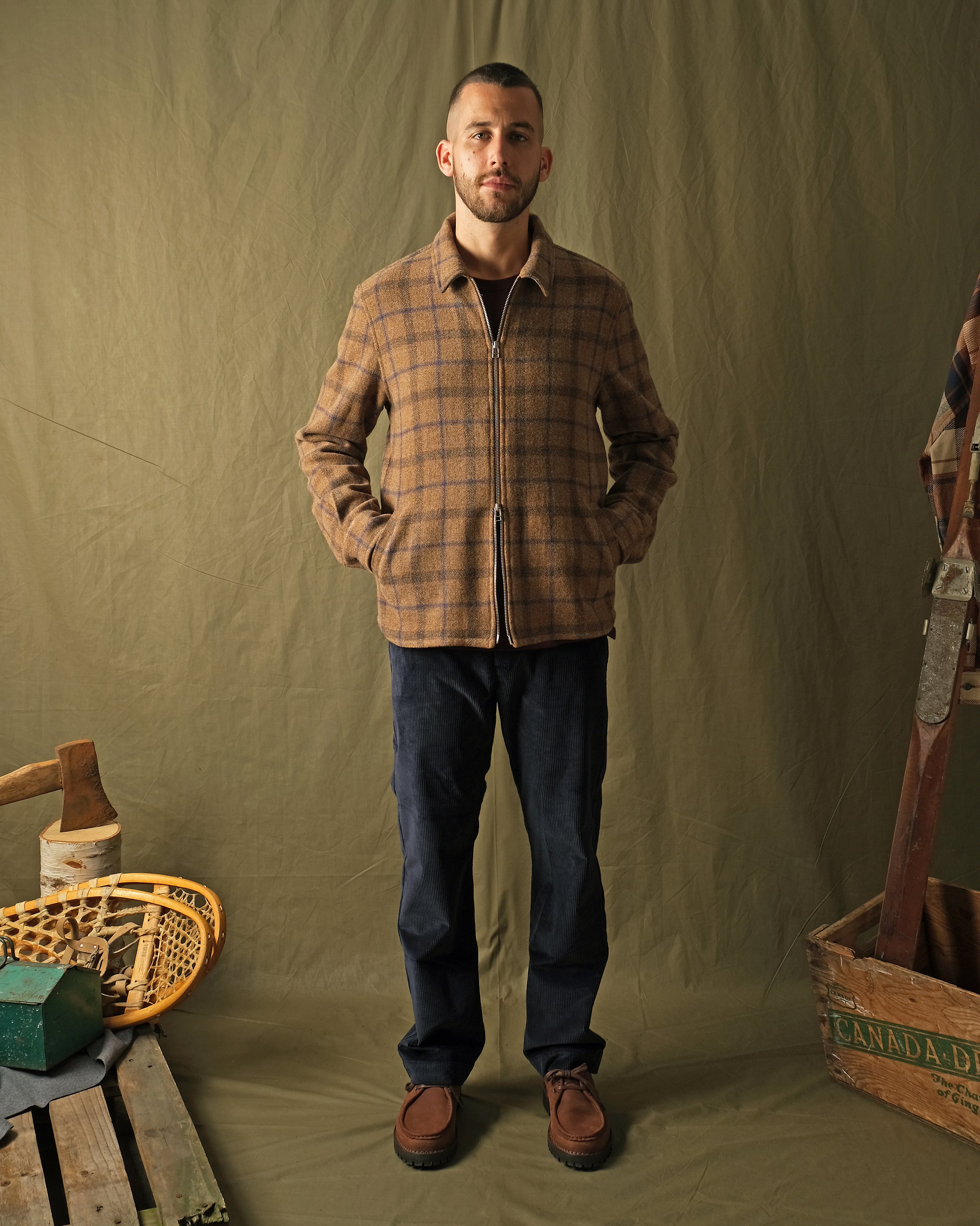 Wool plaid zip overshirt front view on model, stand collar, full zipper, relaxed fit