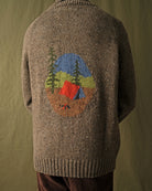 Brown full-zip cardigan worn by a man, camp scene motif centered on the back