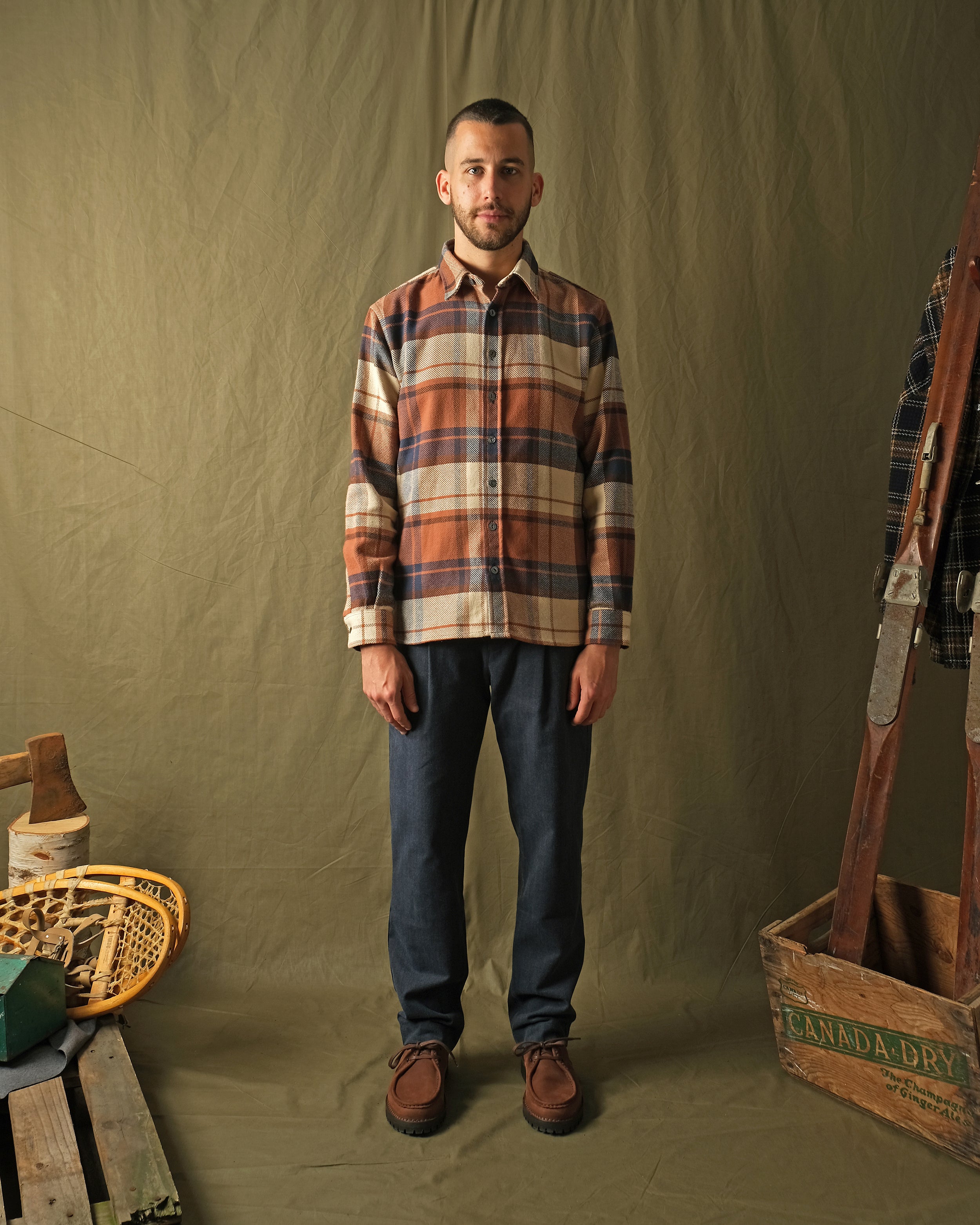 Men's plaid flannel easy shirt, long sleeves with button front; orange, tan, and dark blue