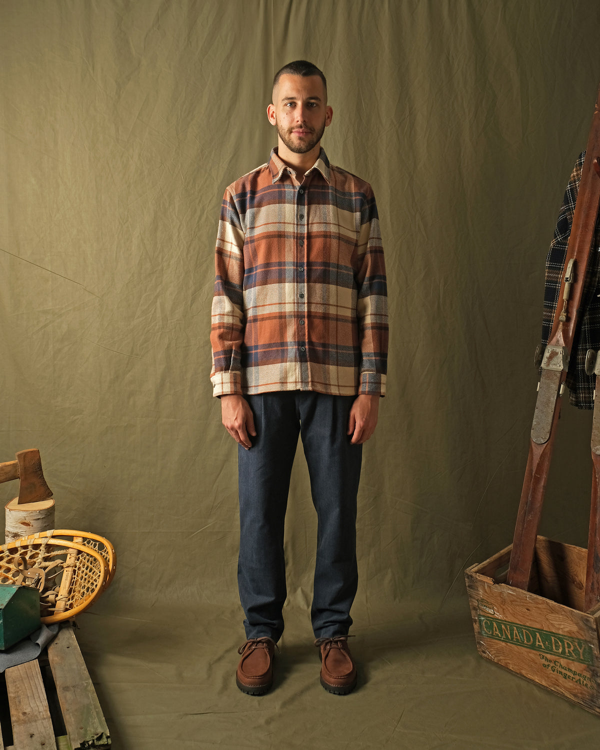Men's plaid flannel easy shirt, long sleeves with button front; orange, tan, and dark blue