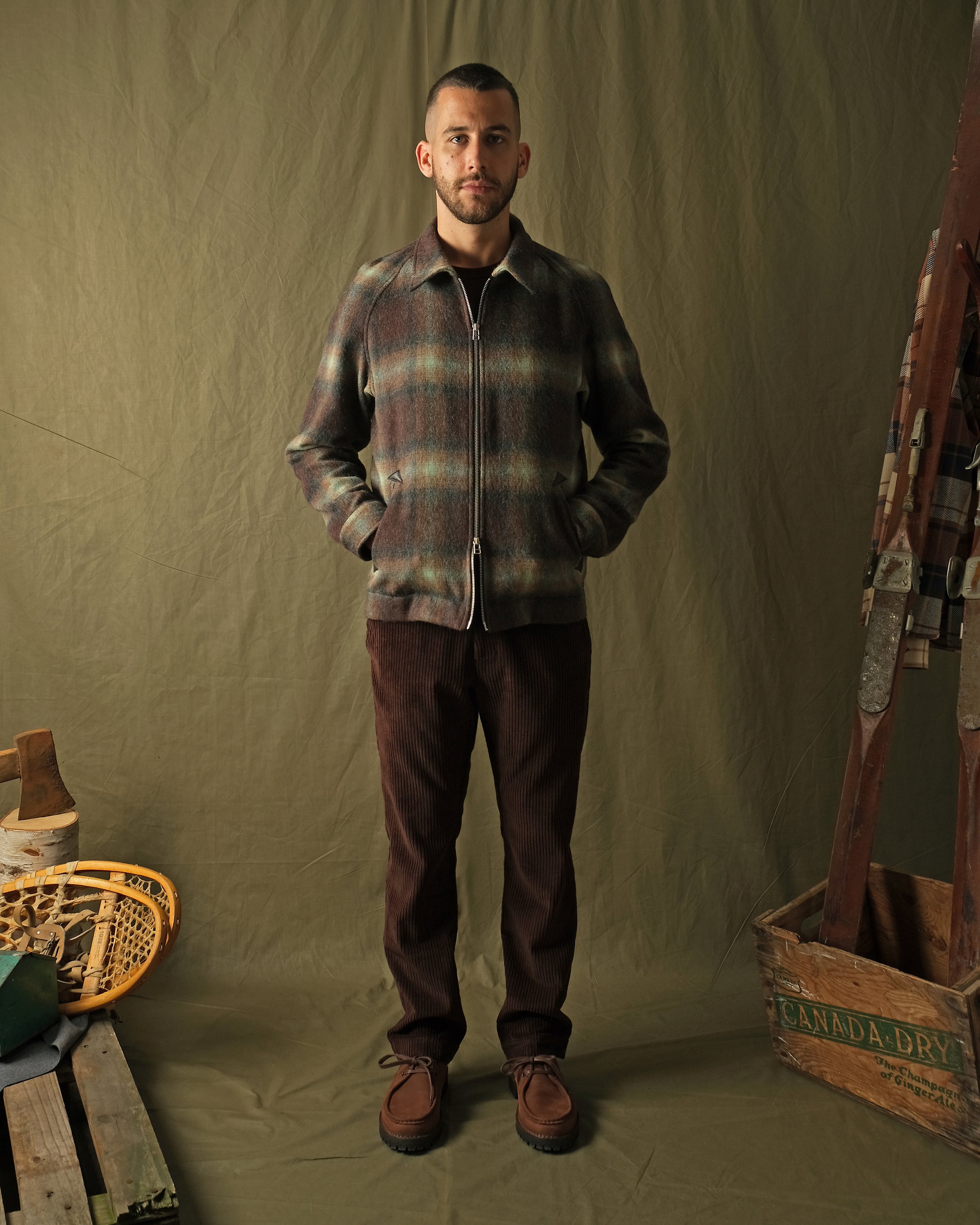 Plaid wool harrington jacket on model, front view with side pockets and zipper