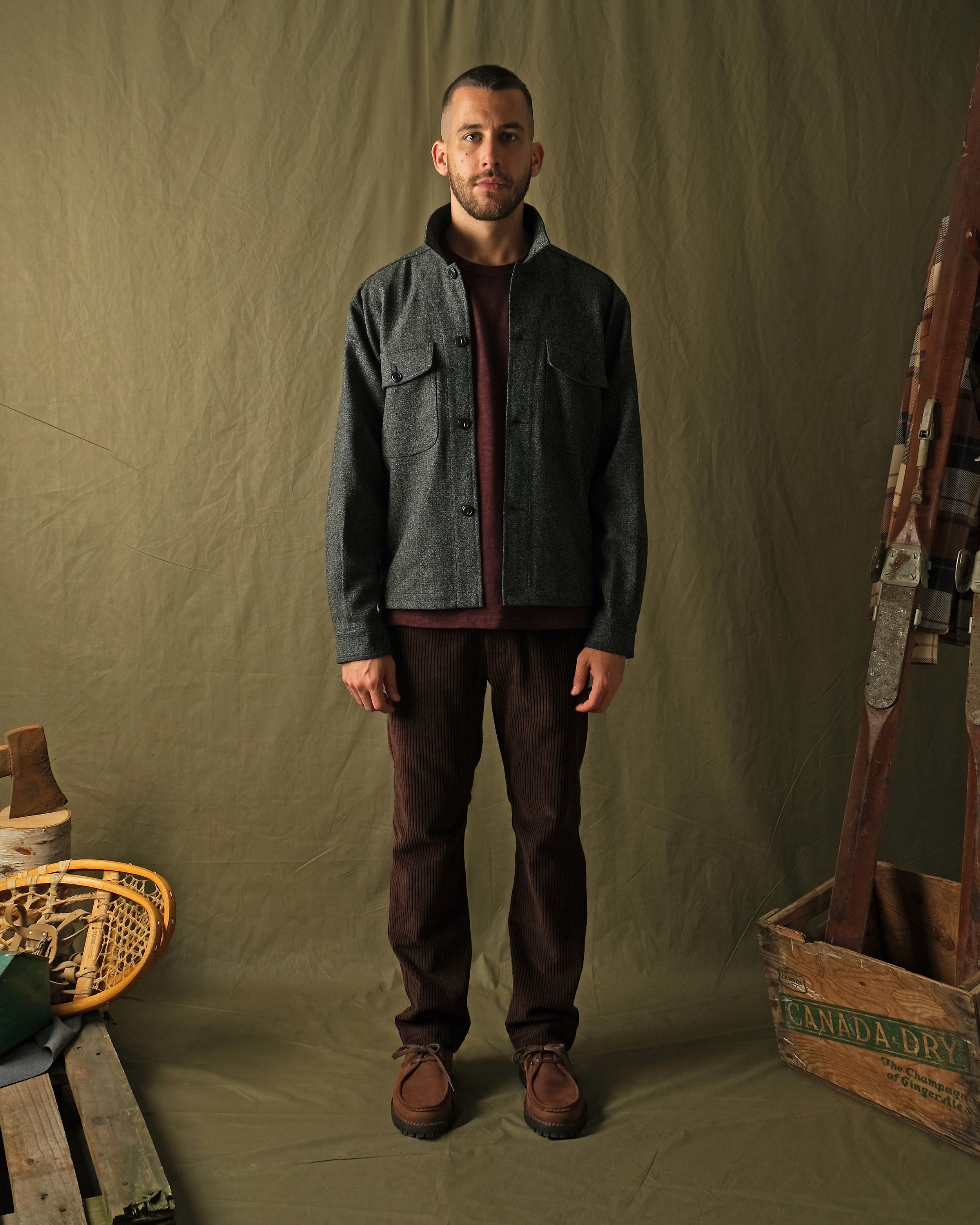 Wool camp shirt in dark charcoal speckled flecks, long sleeves, button front.