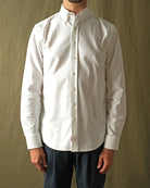 White Oxford button-up shirt view with spread collar and long sleeves