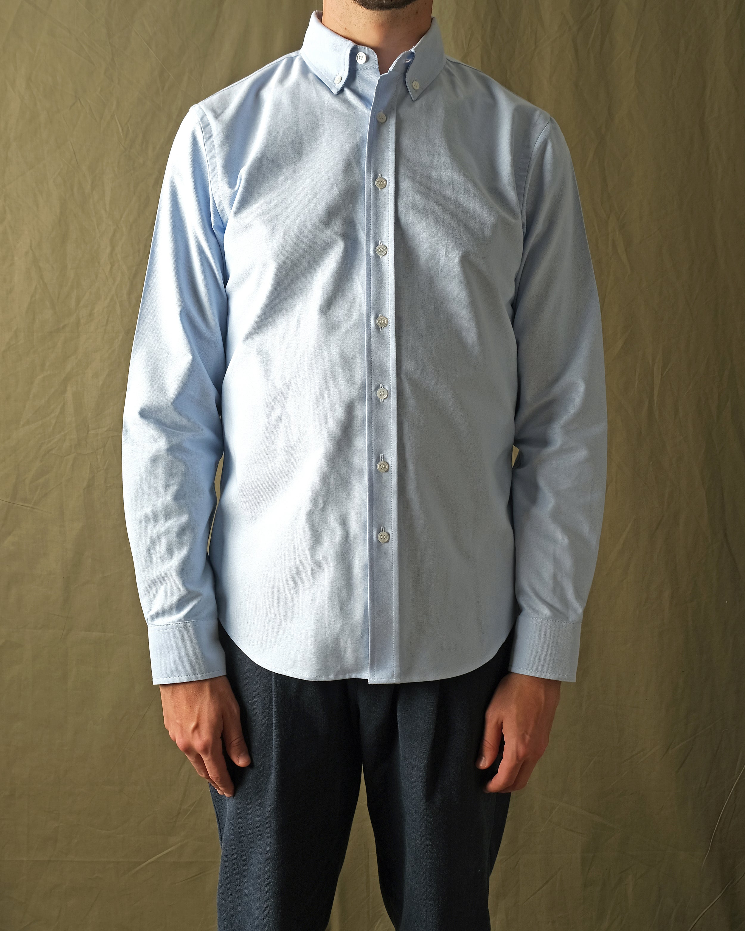 Light blue oxford button-up shirt with long sleeves and front buttons