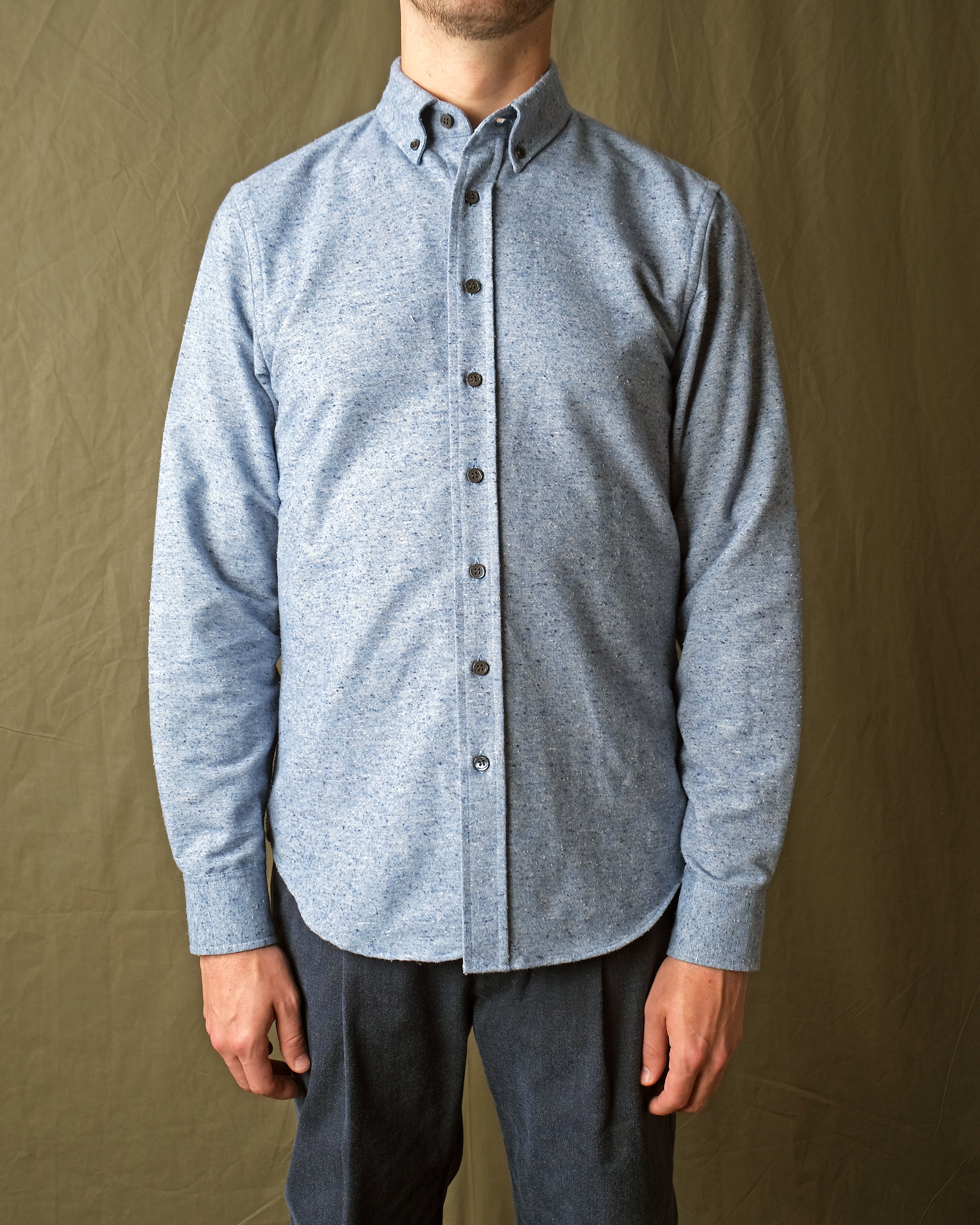 Blue fleck flannel button-up shirt with long sleeves and button-front placket