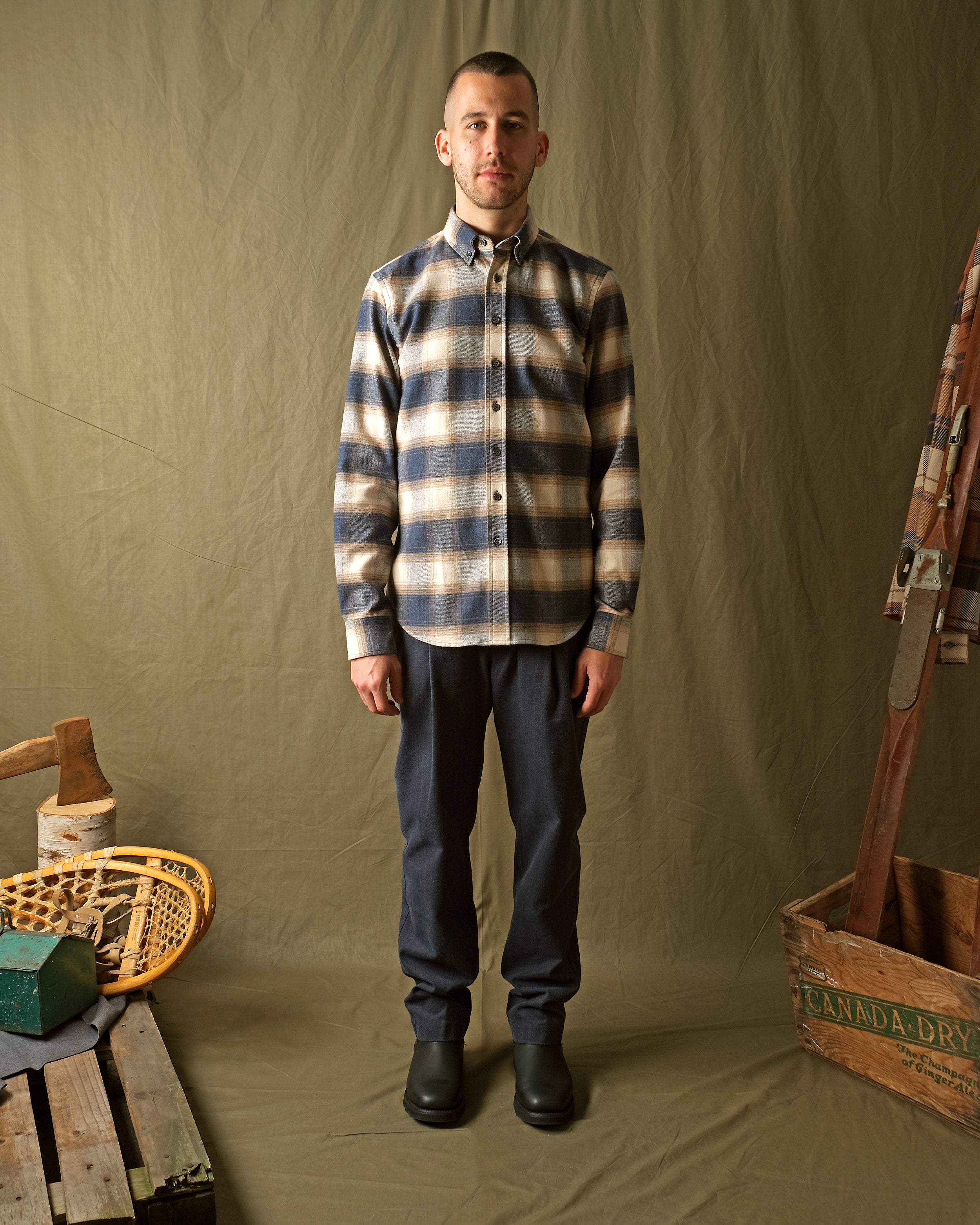 Men's plaid flannel shirt in blue and cream, button-front long sleeves, classic collar