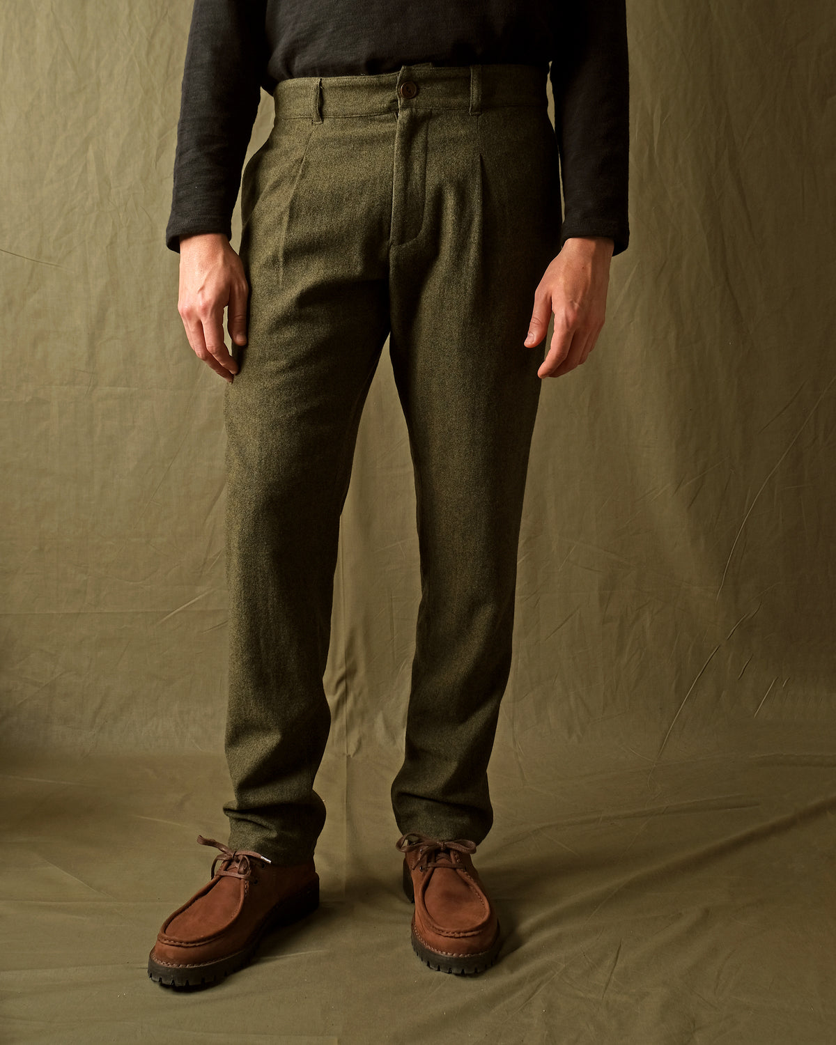 Olive washable wool pleated pants with front fly and side pockets, straight legs