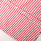 Red-and-white striped button placket with white buttons
