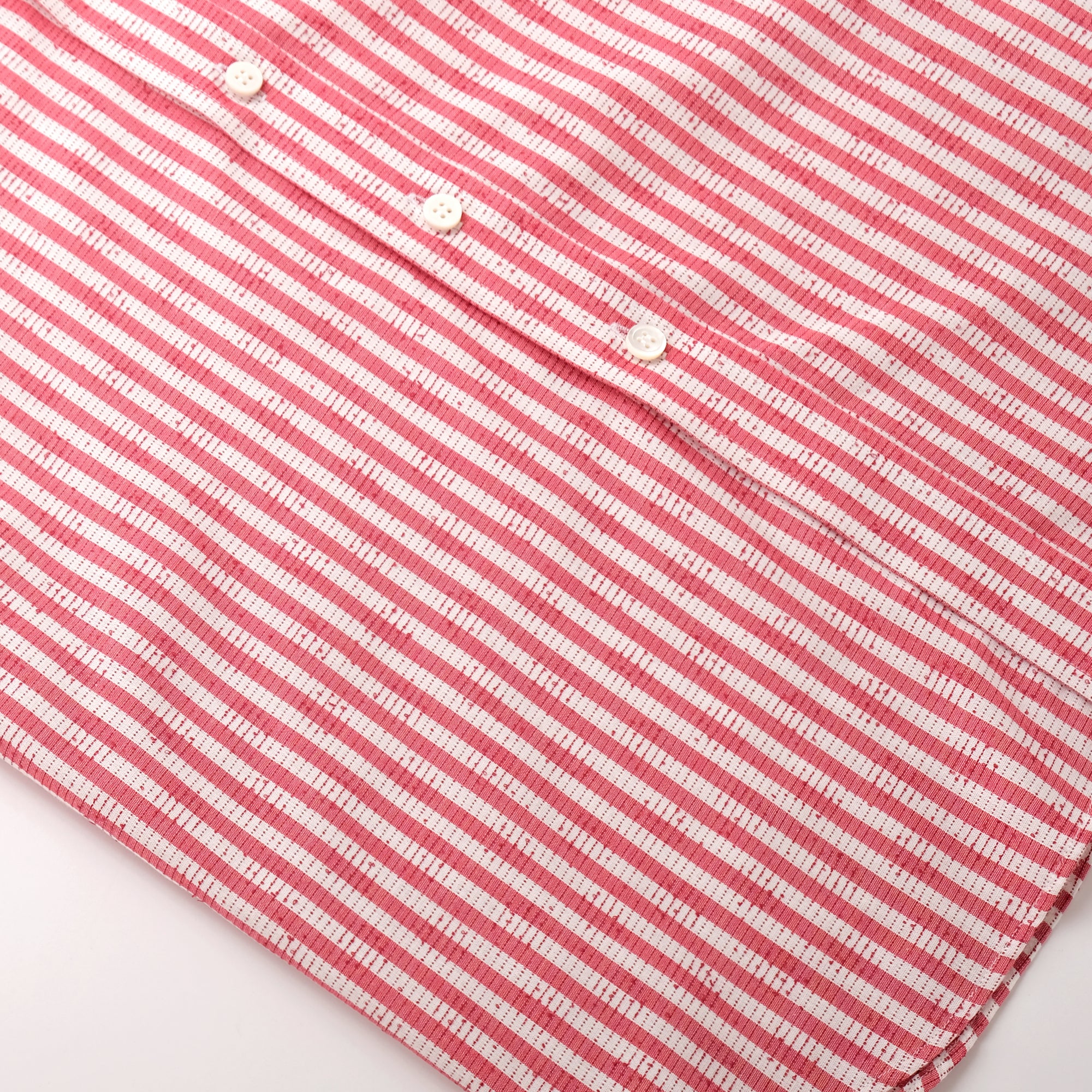 Red-and-white striped button placket with white buttons