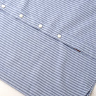 Light blue striped short-sleeve shirt with white button placket and curved hem