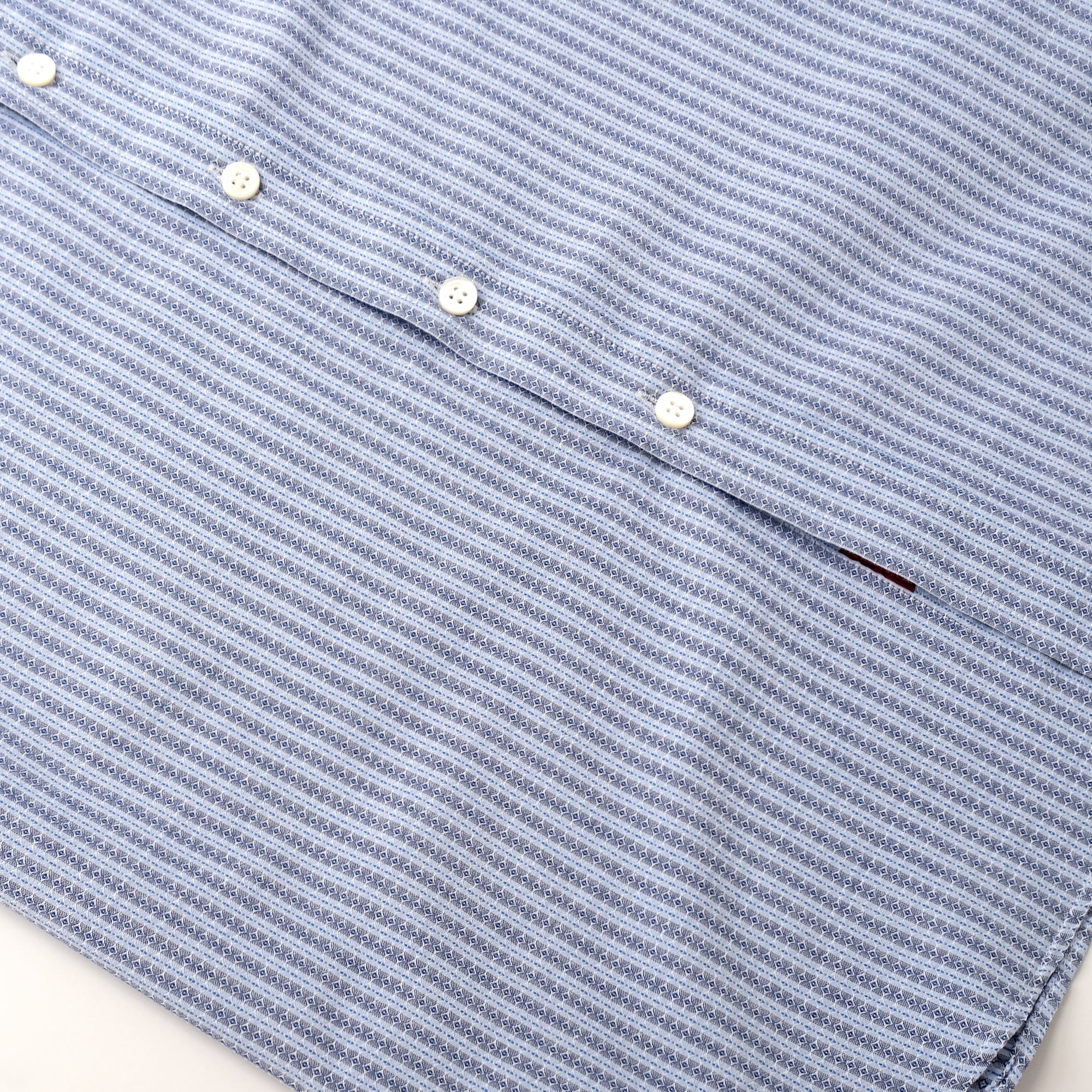 Light blue striped short-sleeve shirt with white button placket and curved hem