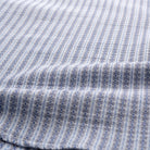 Light blue dobby stripe short-sleeve button-up shirt fabric close-up