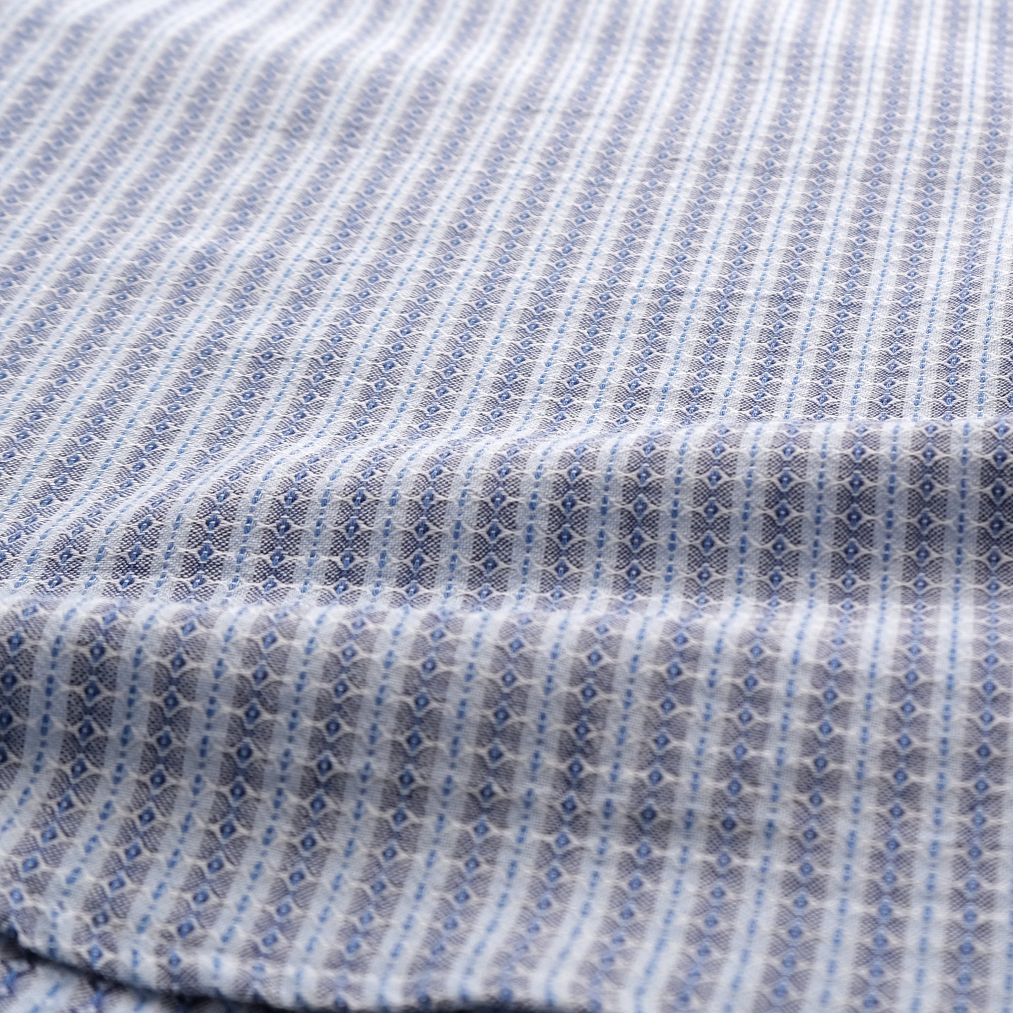 Light blue dobby stripe short-sleeve button-up shirt fabric close-up