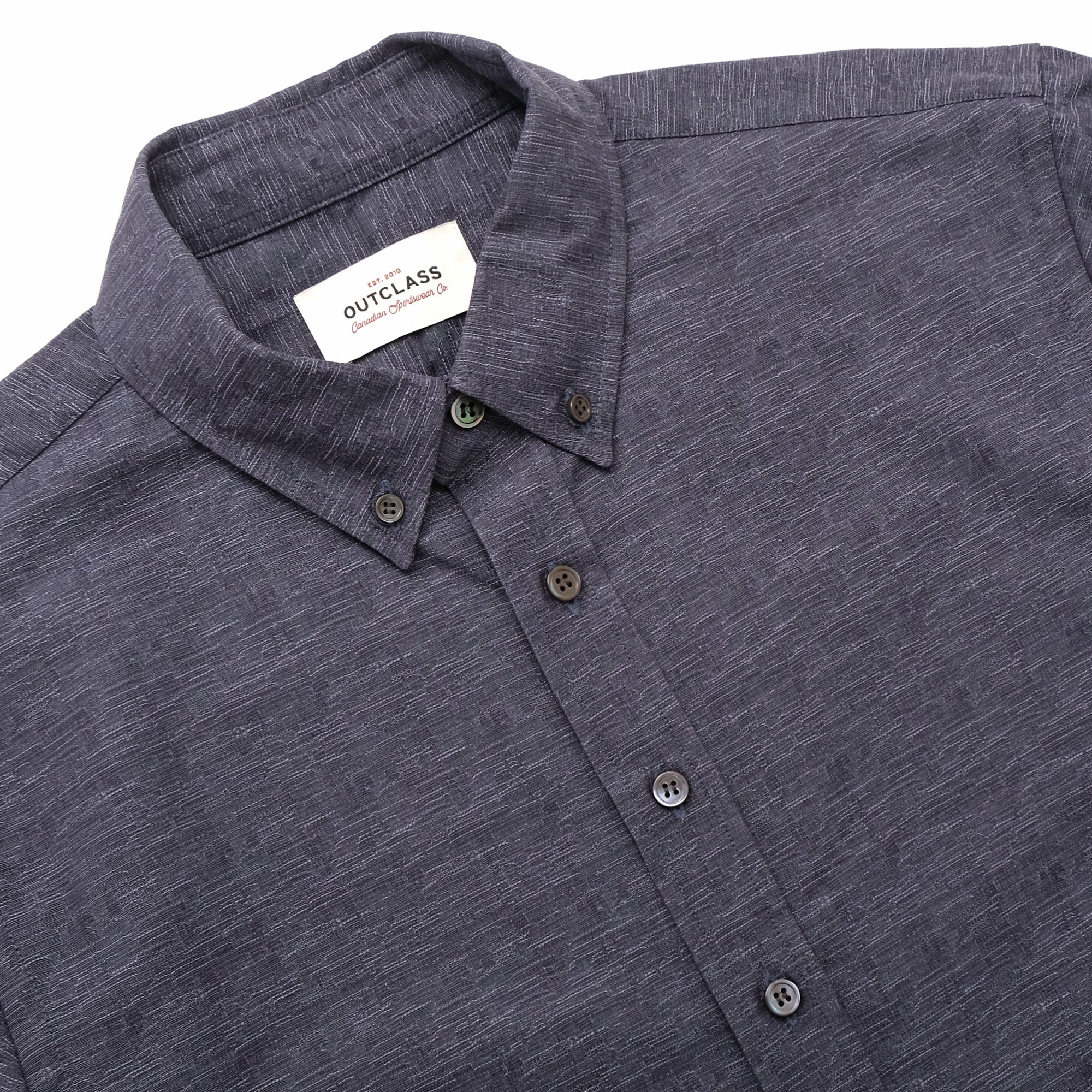 Slate blue short-sleeve button-up shirt showing neck label and front buttons