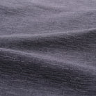 Slate blue shirt fabric close-up with fine textured weave